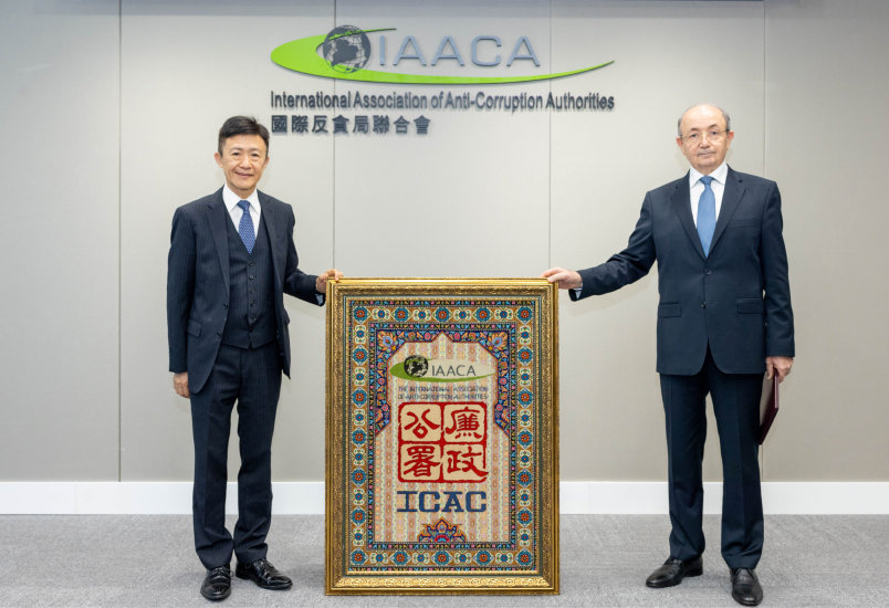 H.E. Mr Fikrat Mammadov, IAACA Vice-President and Minister of Justice of Azerbaijan, presenting a hand-made carpet to IAACA Secretariat